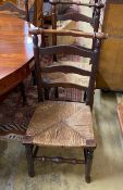 A set of six rush seated ladderback dining chairs