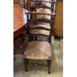 A set of six rush seated ladderback dining chairs