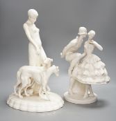 A Royal Dux Art Deco white glazed group modelled as a flapper with two greyhounds, no. 14212, and