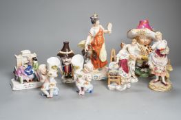 A selection of mainly Continental porcelain figures including Royal Crown Derby style mansion