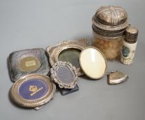 Four small silver mounted photograph frames, one brass frame, a silver lidded jar and one other