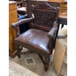 A 19th century Flemish carved oak elbow chair, width 65cm, depth 50cm, height 98cm