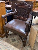 A 19th century Flemish carved oak elbow chair, width 65cm, depth 50cm, height 98cm