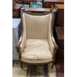 A 19th century French upholstered carved giltwood armchair, width 63cm, depth 62cm, height 112cm