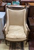 A 19th century French upholstered carved giltwood armchair, width 63cm, depth 62cm, height 112cm