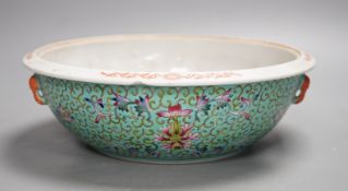 A 20th century Chinese famille rose turquoise ground floral bowl. 23.5cm diameter, lacking cover
