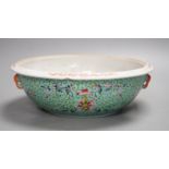 A 20th century Chinese famille rose turquoise ground floral bowl. 23.5cm diameter, lacking cover