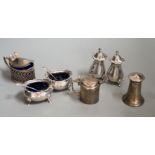 A George V silver four piece condiment set, Birmingham, 1922 and three other silver condiments.