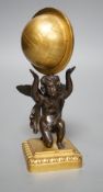 A late 19th century bronze and ormolu model of a cherub supporting a globe, 16cm