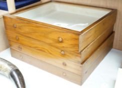 A set of four teak glass topped drawer collector's cases,46cms wide x 40.5cms deep,