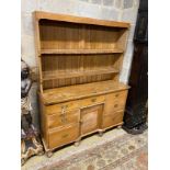 A Victorian pine kitchen dresser, enclosed rack, length 140cm, depth 46cm, height 184cm