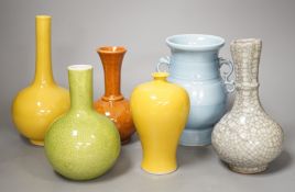 Six various Chinese porcelain or pottery vases, 22cm