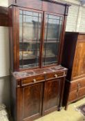 A Regency mahogany bookcase / cupboard, width 106cm, depth 44cm, height 226cm