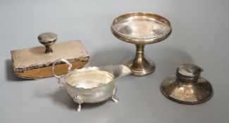 A George VI silver sauceboat, London, 1937, a silver mounted blotter, a silver mounted capstan
