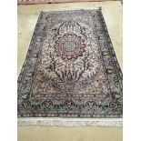 A North West Persian ivory ground rug, 220 x 136cm