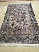 A North West Persian ivory ground rug, 220 x 136cm