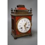 A 19th century French tortoiseshell mantel clock. 24cm high