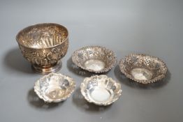 A late 19th/early 20th century repousse silver rose bowl, marks rubbed, diameter 12.6cm and two