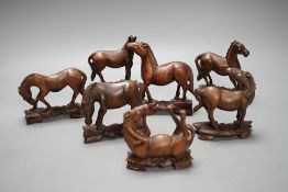 Seven Chinese hardwood models of horses. Tallest 13cm