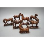 Seven Chinese hardwood models of horses. Tallest 13cm