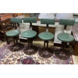 A set of four industrial style swivel stools, height 83cm