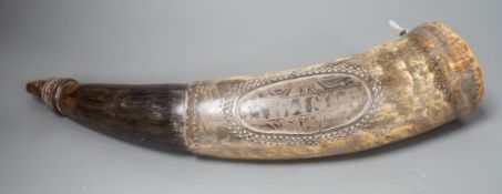 An early 19th century scrimshaw powder horn, ornately engraved with the Royal Coat of Arms, a castle