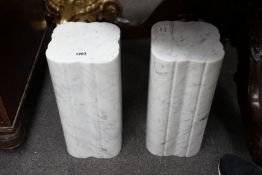 A pair of reconstituted white marble stands, height 38cm