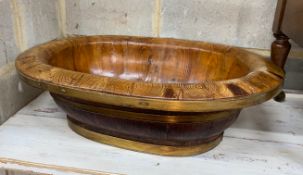 A brass mounted oval staved wood bowl, width 48cm, depth 37cm, height 15cm