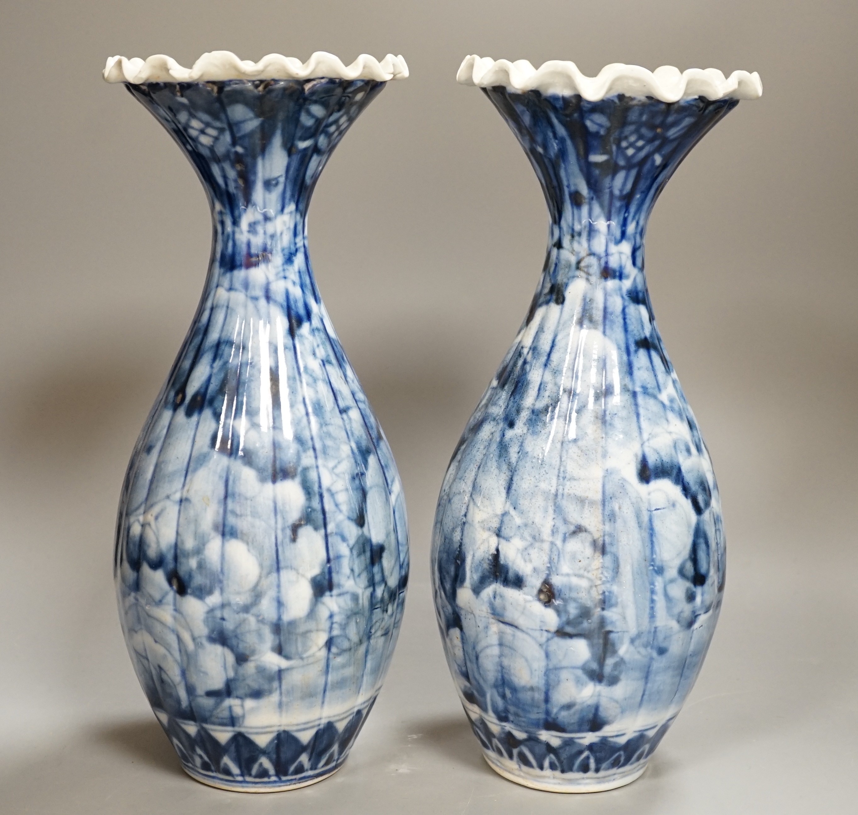A pair of early 20th century Japanese fluted blue and white flared rim vases, 31.5cm - Image 2 of 6