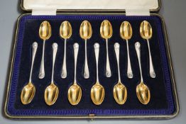 A cased set of twelve late Victorian silver 'picture back' coffee spoons, by Thomas Bradbury & Sons,