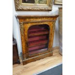 A Victorian burr walnut and floral marquetry inlaid gilt metal mounted pier cabinet, width 82cm,