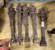 A set of five cast iron posts with flambe finials, height 56cm