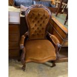 A Victorian walnut upholstered spoon back armchair