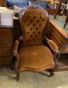 A Victorian walnut upholstered spoon back armchair