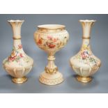 A pair of Royal Worcester blush ivory vases and a similar pedestal vase, tallest 27cm