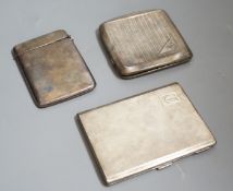 A George V engine turned silver cigarette case, 11.4cm, one other silver cigarette case and a silver
