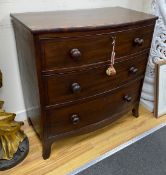 A late Regency coromandel banded mahogany bowfront chest of three drawers, height 85.5cm, width