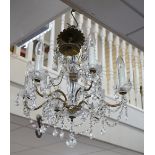 A cut glass six branch chandelier, 52cms high,