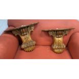 A pair of Victorian style carved walnut wall brackets, width 53cm, height 48cm