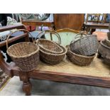 Five wicker baskets, largest length 53cm