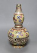 A Chinese enamelled porcelain double walled rotating vase, 24cm