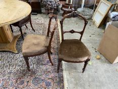 A set of four Victorian walnut dining chairs