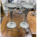 A pair of cast metal stag's head candlestands, height 39cm with snuffer