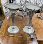 A pair of cast metal stag's head candlestands, height 39cm with snuffer