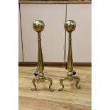 A pair of brass andirons. 57cm high