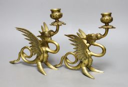 A pair of Griffin candlesticks, 19cm