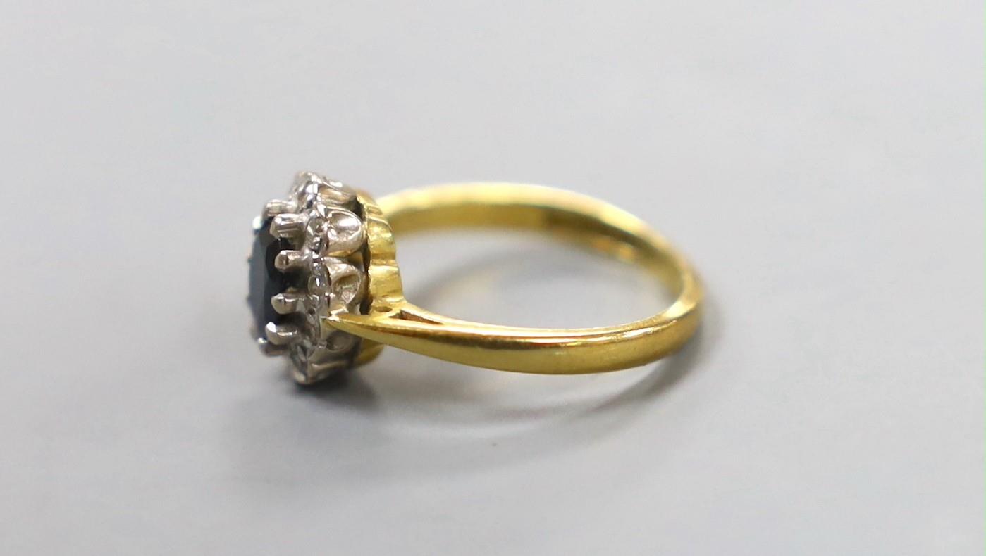 A modern 18ct gold, sapphire and diamond chip set oval cluster ring, size G, gross weight 3.1 - Image 2 of 3