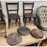 A pair of early 20th century elm and beech childs chairs and three African trivets