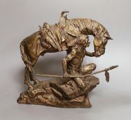 A bronze figure group of a Native American kneeling next to his horse - 'Protector of the Plains' by