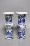 A pair of 19th century Chinese blue and white beaker vases, 23.5cm